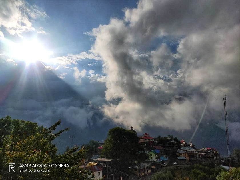 Sunrise through clouds over Kinnaur Kailash group of peaks