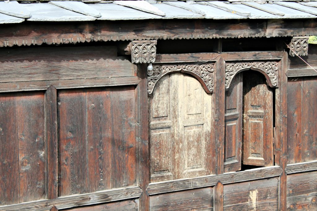 Carvings on wooden window , en route Kamru , Baspa valley , Kinnaur